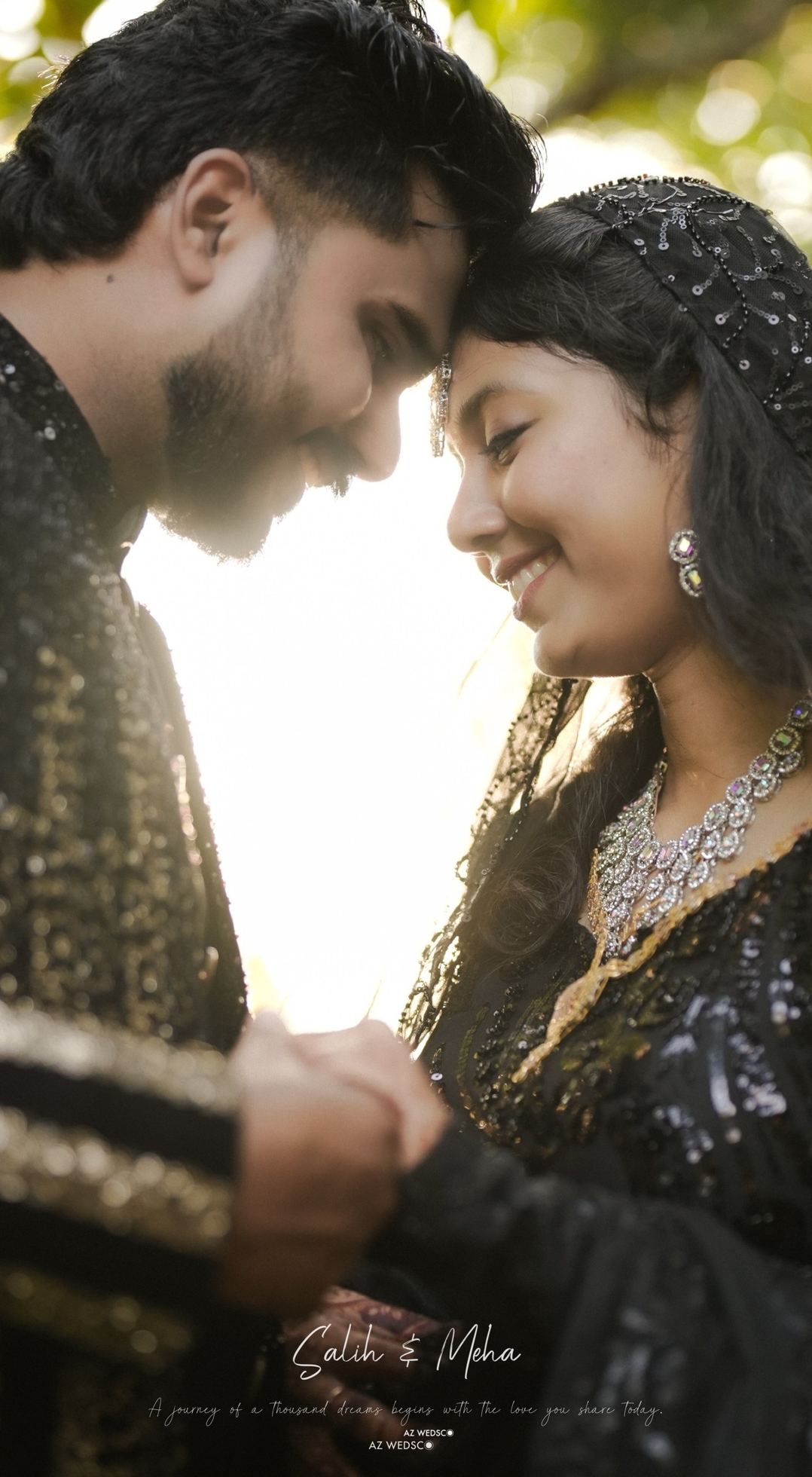 Bride and groom touching foreheads in golden light